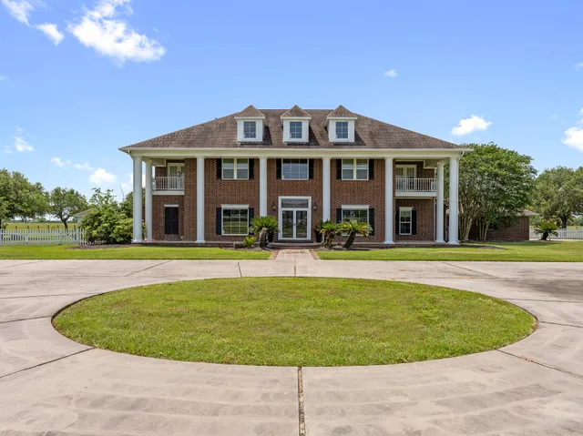 a view of a dining room with furniture wooden floor and chandelier
