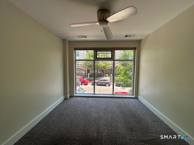 111 Morgan Street, Unit TH5 Stamford, CT 06905 - Photo 12 of 23 a view of an empty room with a window