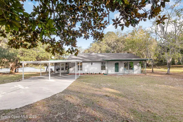 front view of a house with a big yard