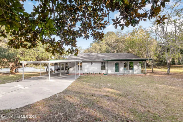 front view of a house with a big yard