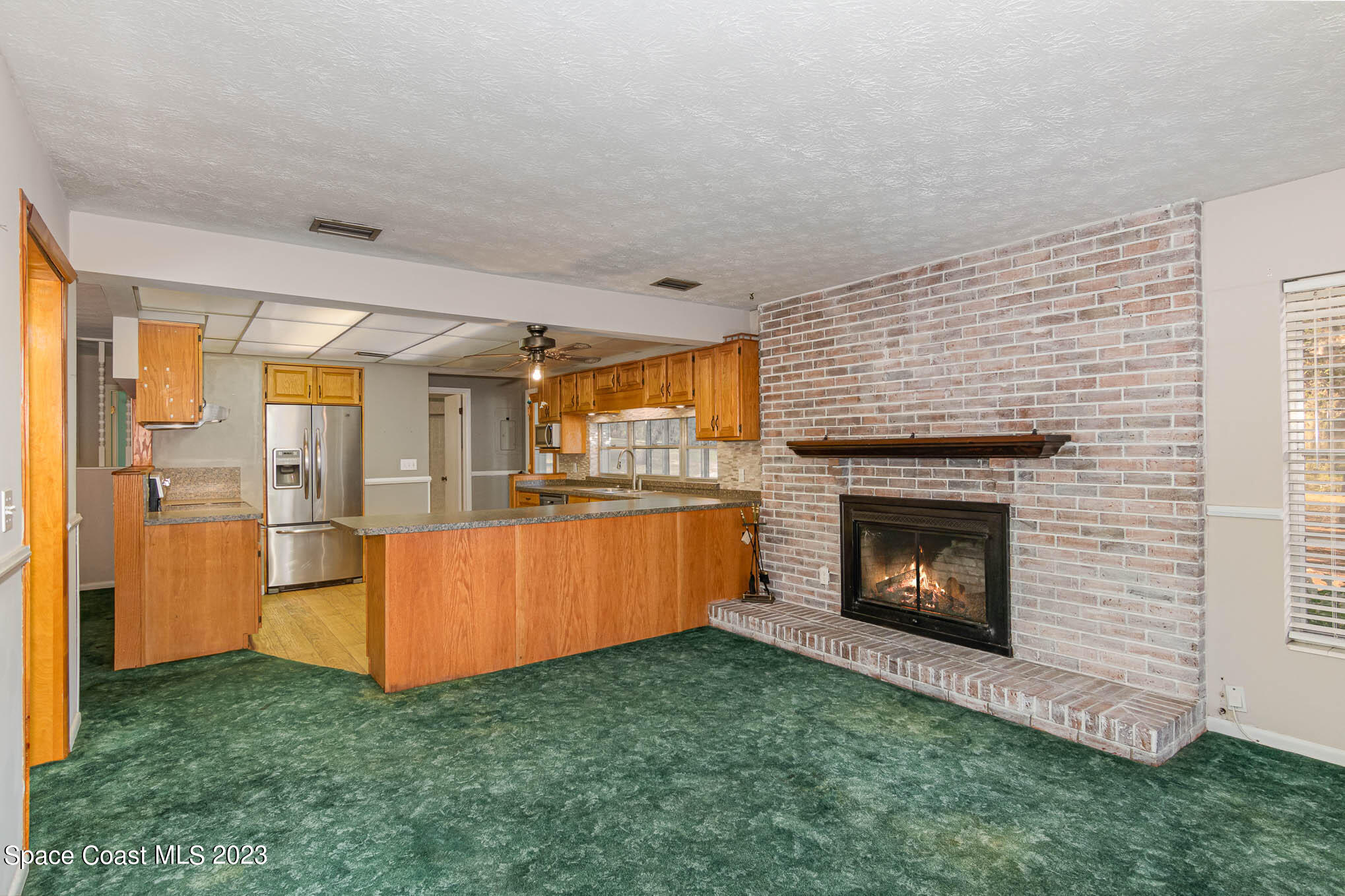 8203 Lake Echo Ridge Drive Melrose, FL 32666 - Photo 16 of 31 a living room with furniture and a fireplace