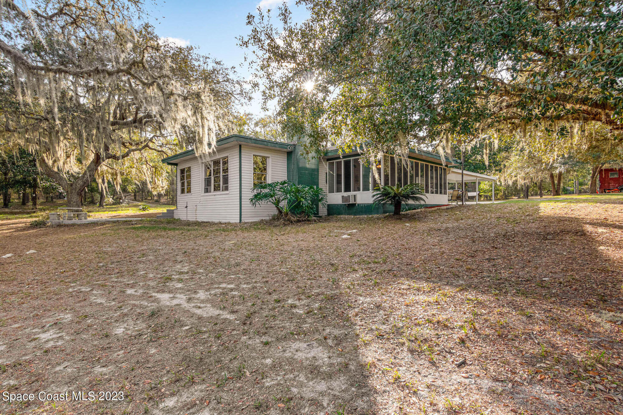 8203 Lake Echo Ridge Drive Melrose, FL 32666 - Photo 2 of 31 a view of a house with a yard and large trees