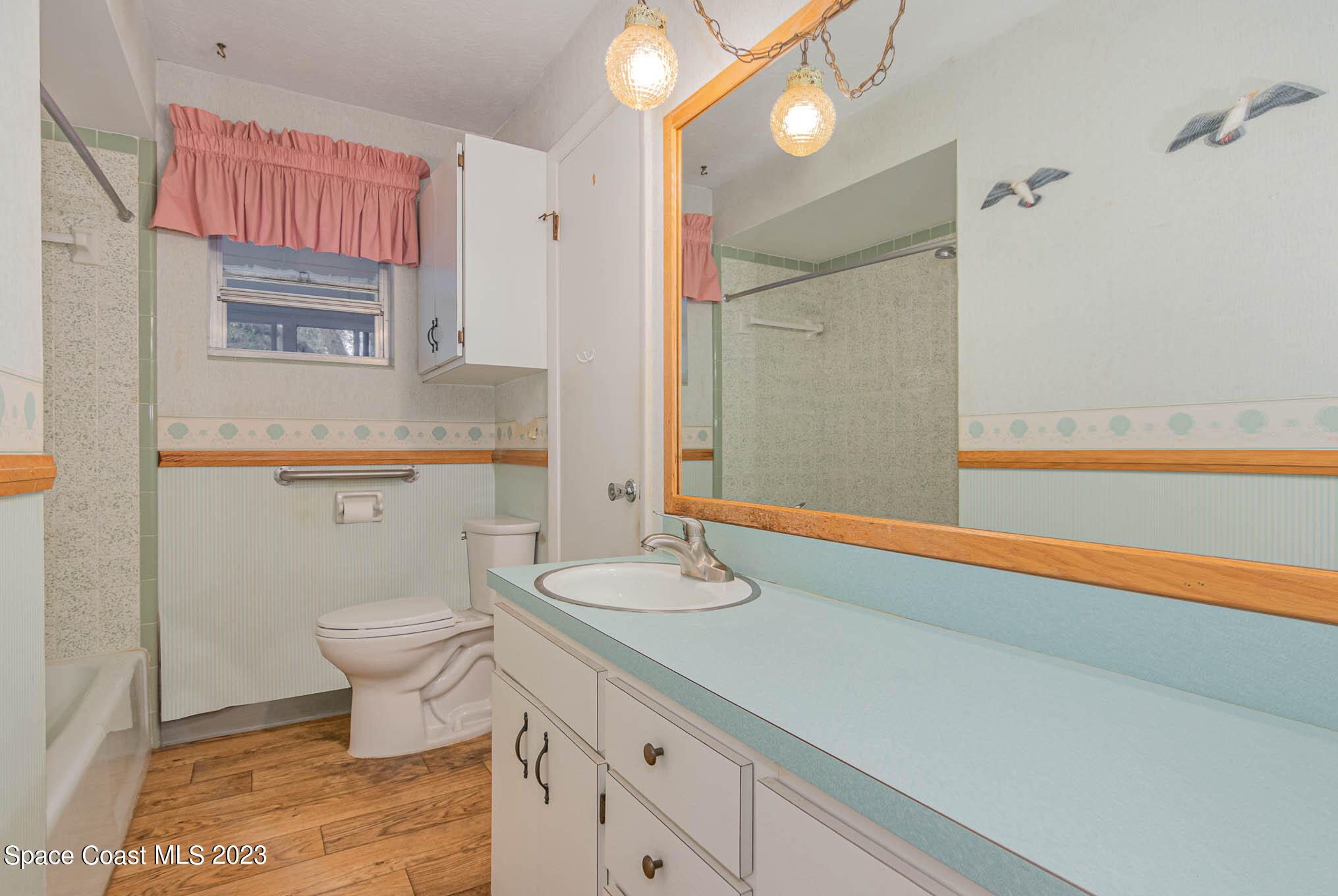 8203 Lake Echo Ridge Drive Melrose, FL 32666 - Photo 27 of 31 a bathroom with a sink a toilet and a mirror