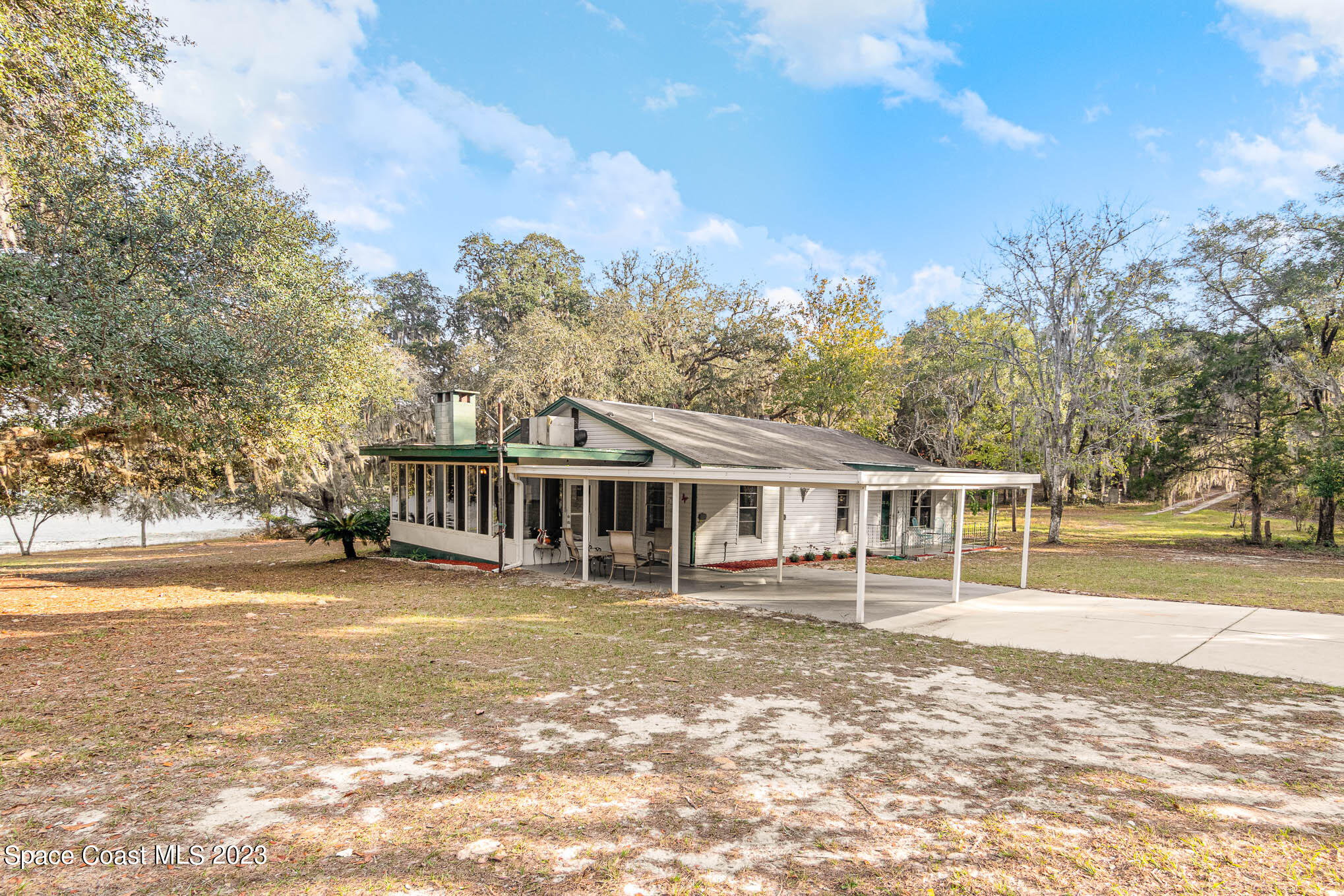 8203 Lake Echo Ridge Drive Melrose, FL 32666 - Photo 29 of 31 a view of a house with a big yard and large trees
