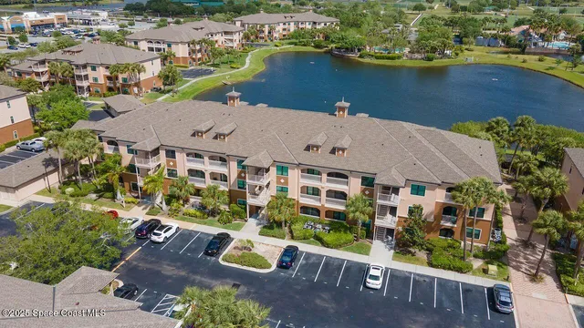 an aerial view of a house with a lake view