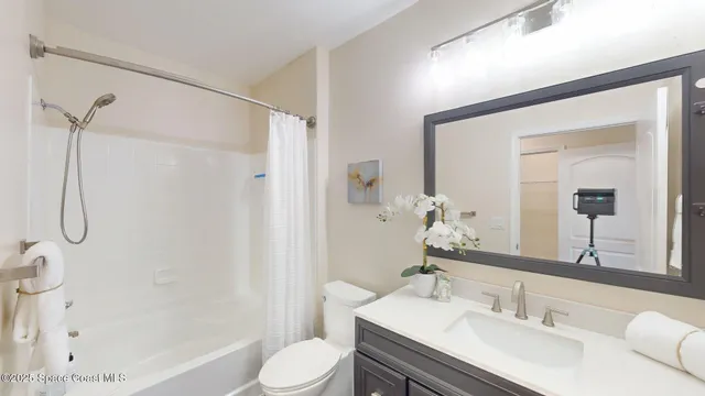 a bathroom with a sink toilet tub and shower