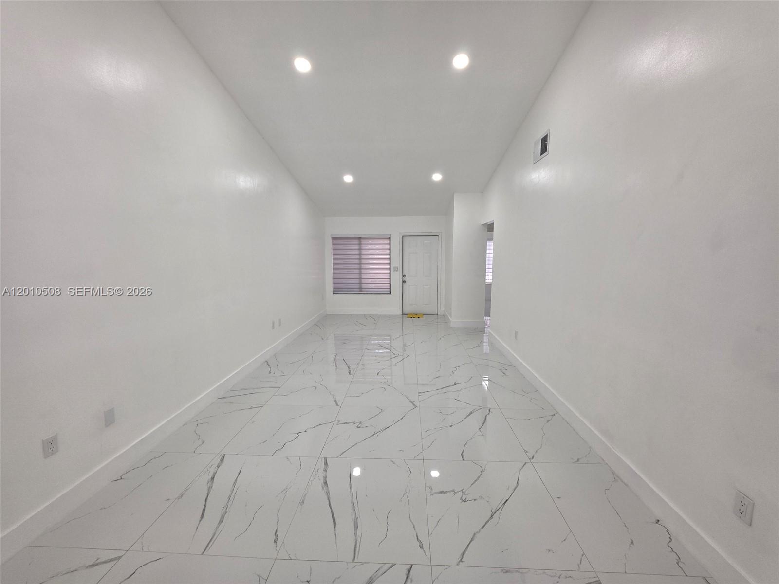 14775 Southwest 83rd Lane, Unit 14775 Miami, FL 33193 - Photo 11 of 26 view from kitchen to front door