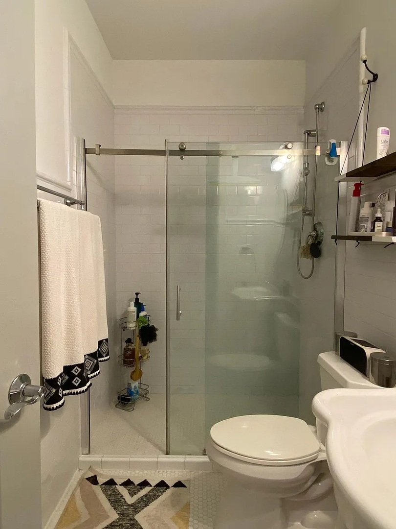 2157 West Adams Street, Unit 1 Chicago, IL 60612 - Photo 4 of 10 a bathroom with a toilet and a shower