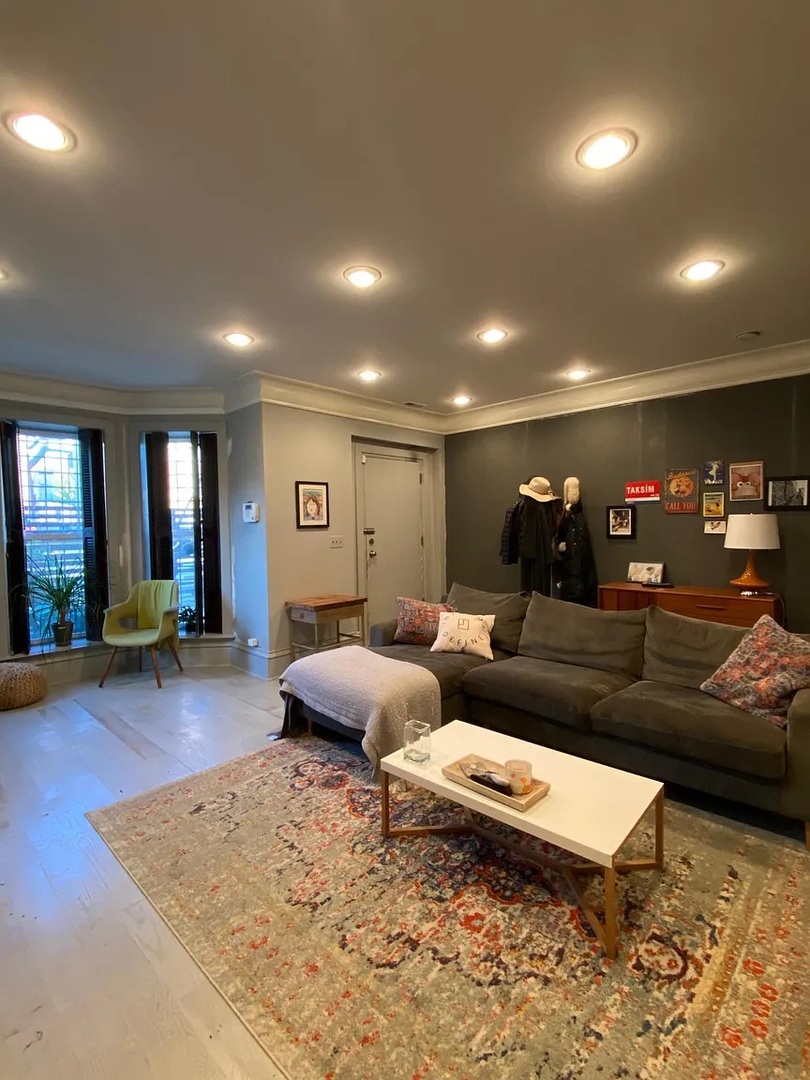 2157 West Adams Street, Unit 1 Chicago, IL 60612 - Photo 5 of 10 a living room with furniture and a wooden floor