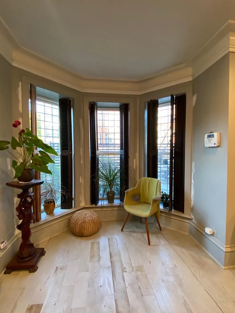 2157 West Adams Street, Unit 1 Chicago, IL 60612 - Photo 10 of 10 a living room with furniture and a fireplace