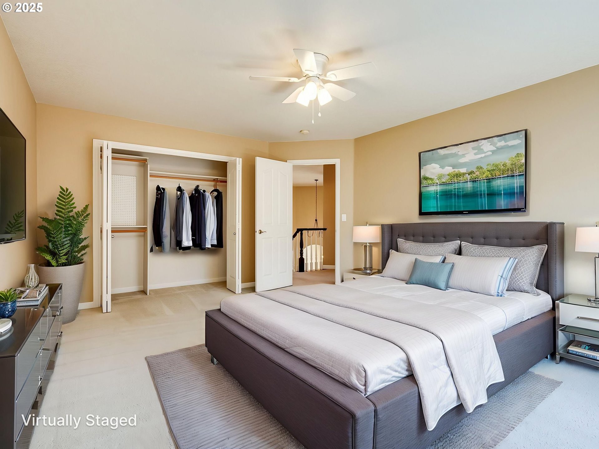 2745 Northwest 29th Avenue Camas, WA 98607 - Photo 21 of 29 a spacious bedroom with a large bed and a chandelier
