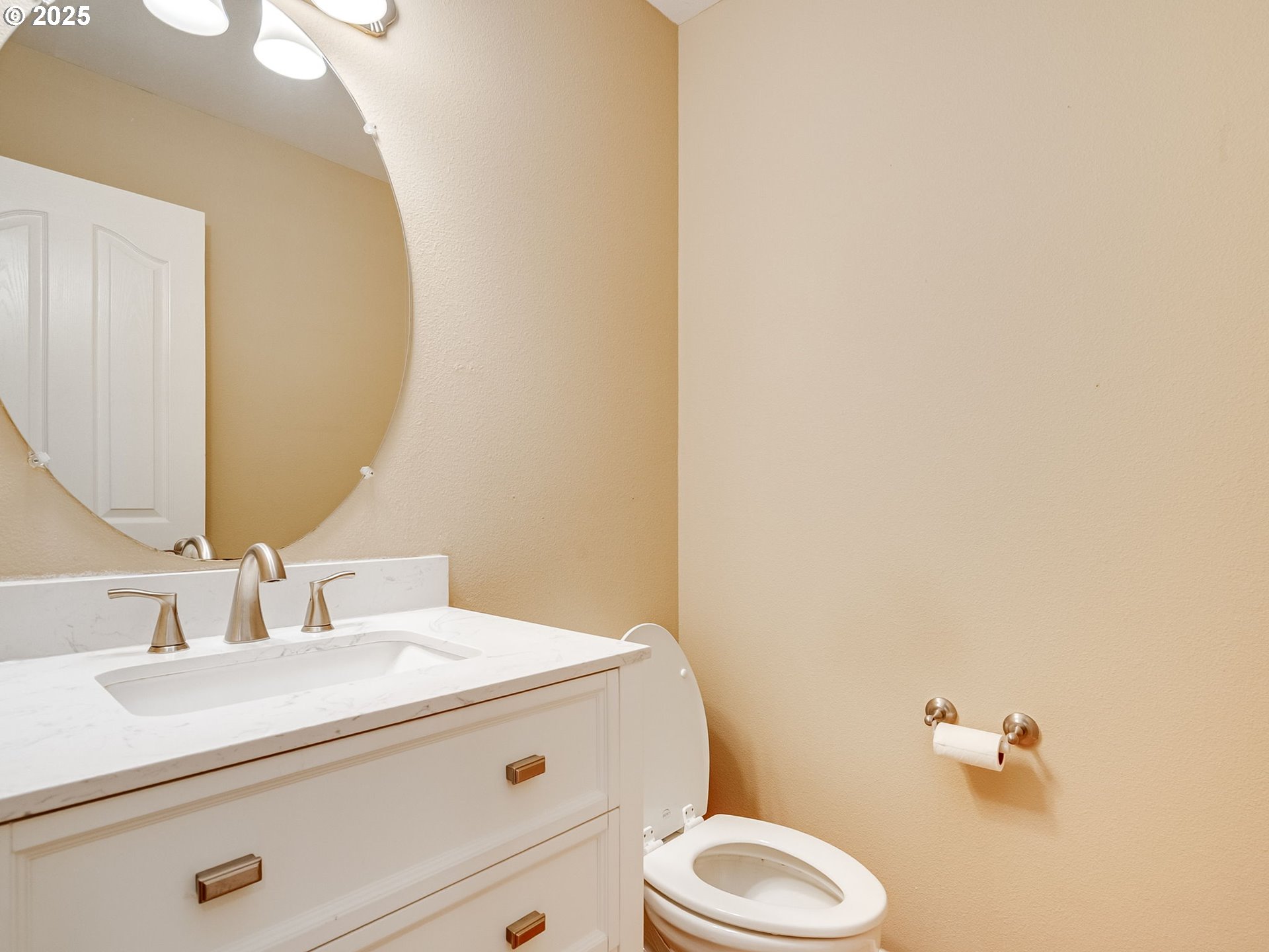 2745 Northwest 29th Avenue Camas, WA 98607 - Photo 5 of 29 a bathroom with a sink a toilet and a mirror