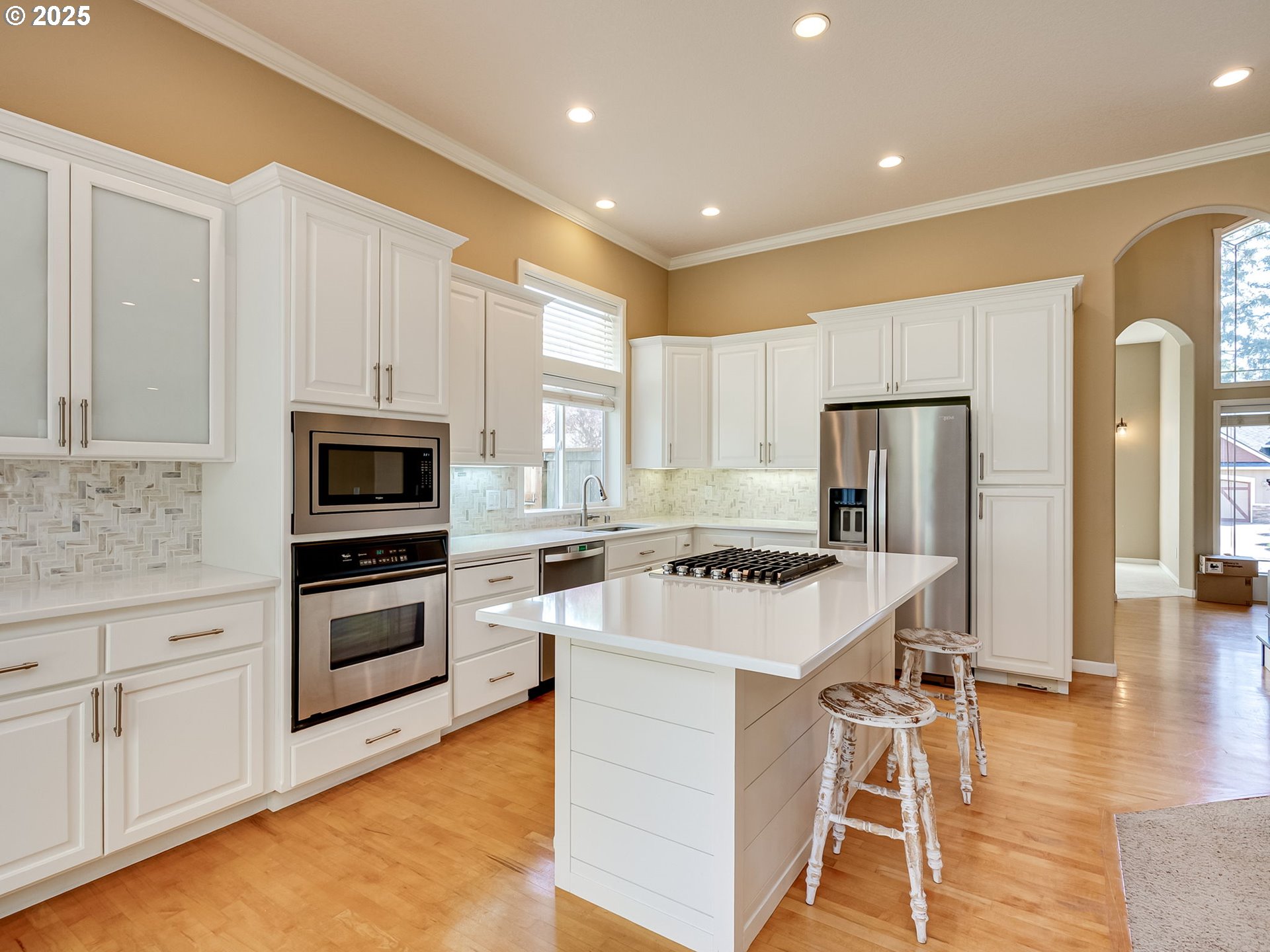 2745 Northwest 29th Avenue Camas, WA 98607 - Photo 7 of 29 a kitchen with white cabinets and stainless steel appliances