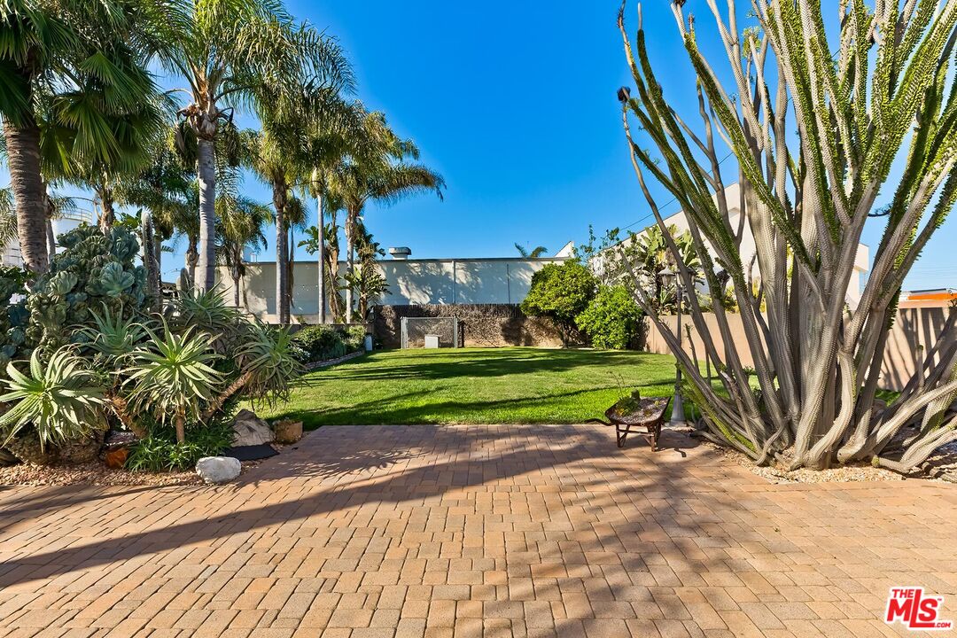 1657 East 218th Street Carson, CA 90745 - Photo 2 of 24 a view of a yard with plants and trees