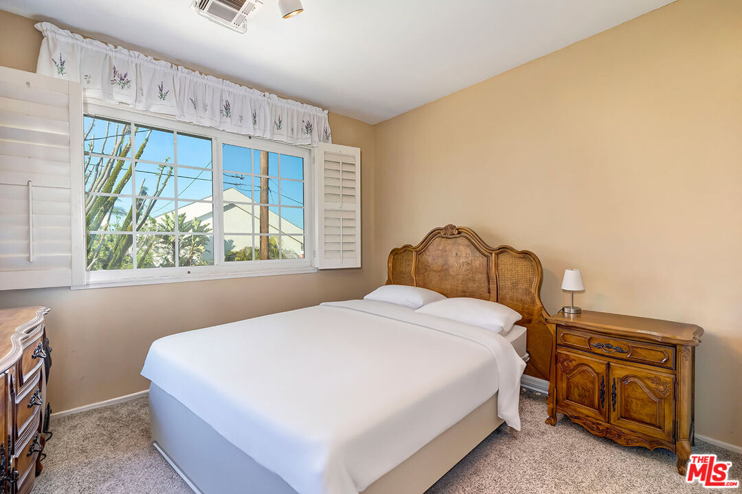 1657 East 218th Street Carson, CA 90745 - Photo 24 of 24 a bedroom with a bed and a window