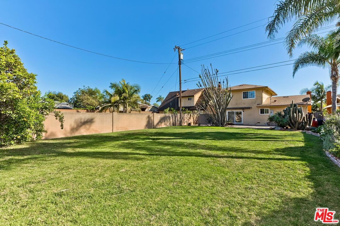 1657 East 218th Street Carson, CA 90745 - Photo 5 of 24 a front view of a house with garden
