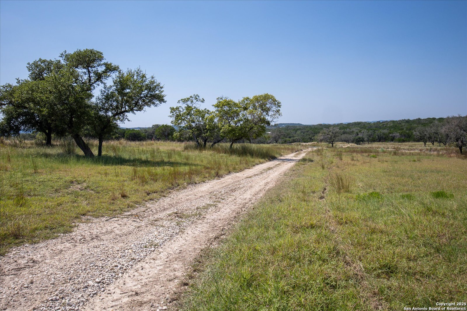 34 Cravey Road Boerne, TX 78006 - Photo 56 of 59 a view of a lake with a big yard