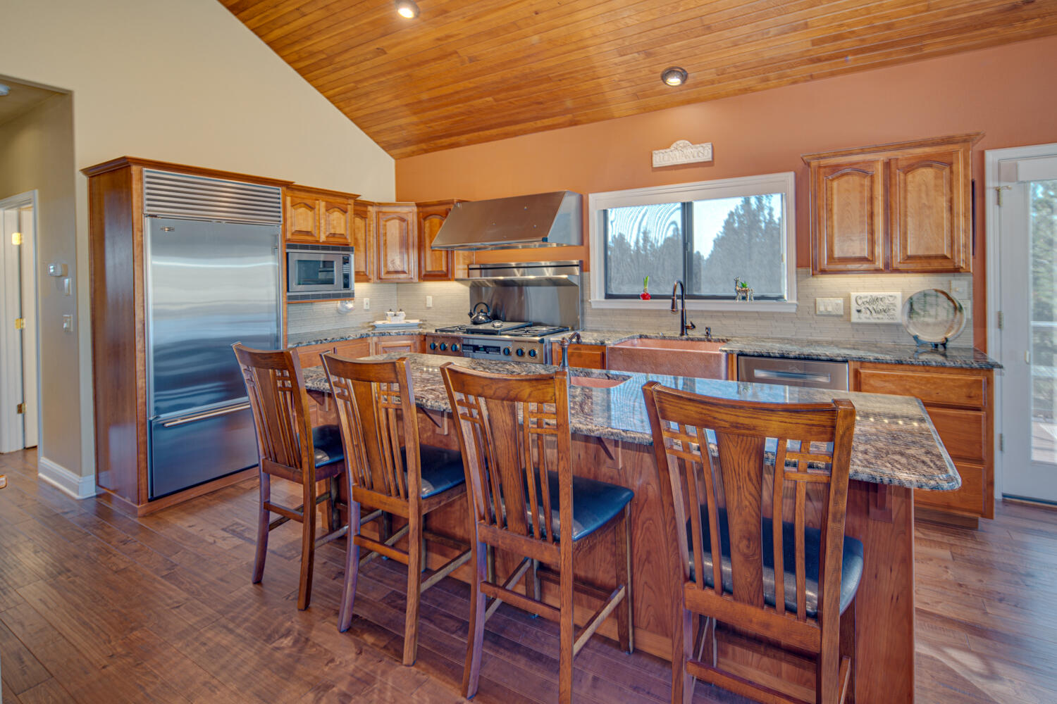 66250 Gerking Market Road Bend, OR 97703 - Photo 20 of 86 a view of a dining room with furniture window and wooden floor