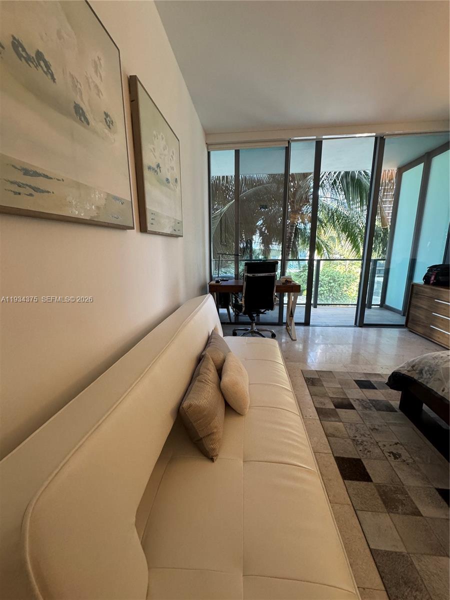 88 Southwest 7th Street, Unit 805 Miami, FL 33130 - Photo 7 of 14 a living room with large window