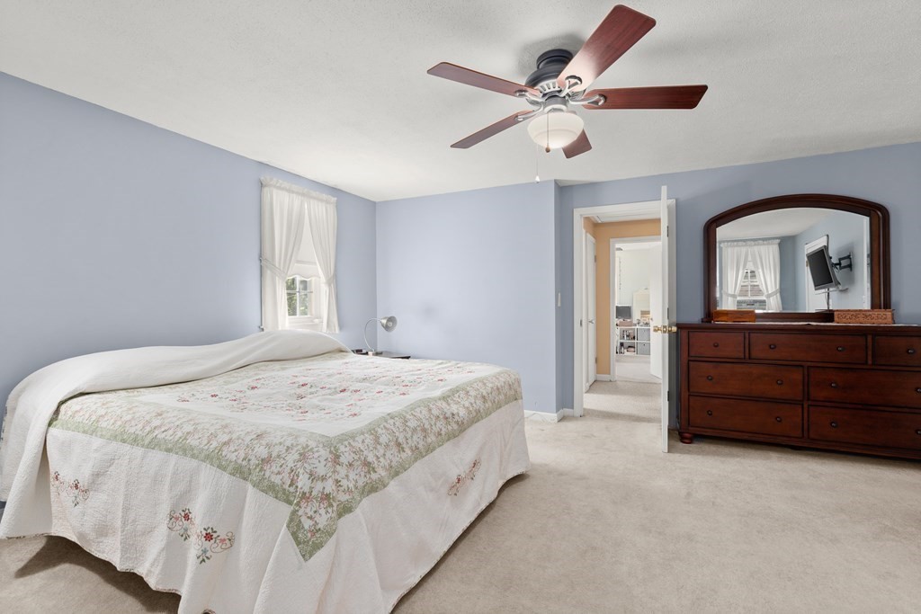 179 Baldwin Road Billerica, MA 01821 - Photo 17 of 38 a spacious bedroom with a bed and a dresser