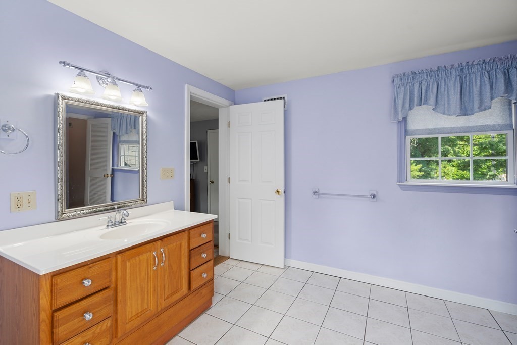 179 Baldwin Road Billerica, MA 01821 - Photo 20 of 38 a spacious bathroom with a sink and a mirror