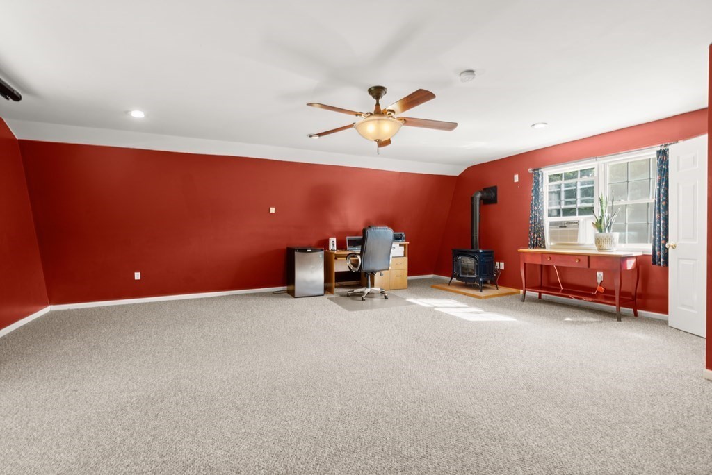 179 Baldwin Road Billerica, MA 01821 - Photo 22 of 38 a view of a livingroom with a window and a flat screen tv
