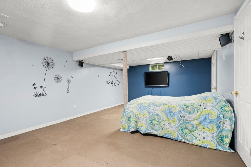 179 Baldwin Road Billerica, MA 01821 - Photo 23 of 38 a bedroom with a bed and a window