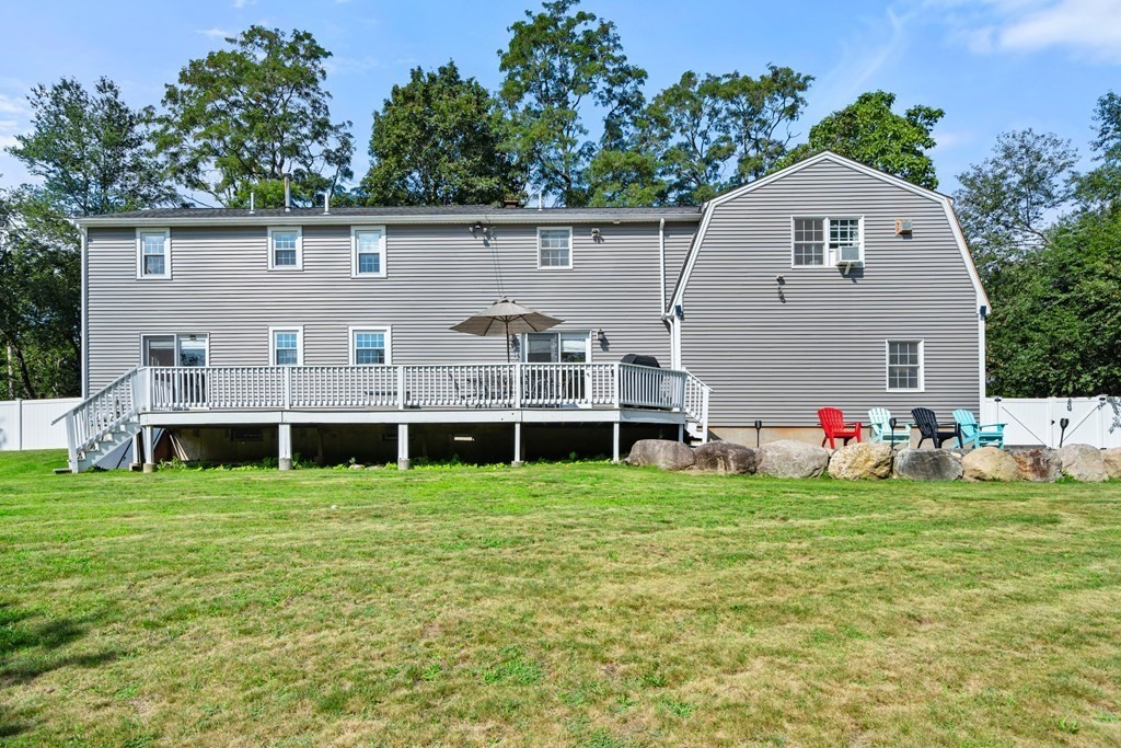 179 Baldwin Road Billerica, MA 01821 - Photo 30 of 38 a view of a house with a yard and trees