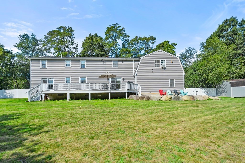 179 Baldwin Road Billerica, MA 01821 - Photo 31 of 38 a view of a house with a yard and sitting area