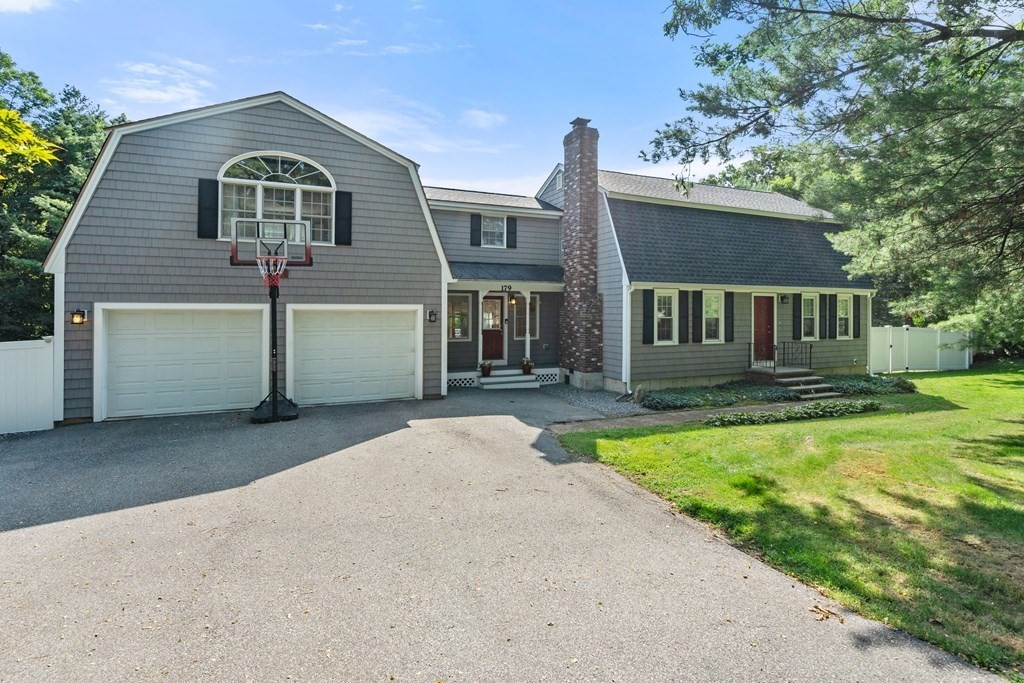 179 Baldwin Road Billerica, MA 01821 - Photo 35 of 38 a front view of a house with yard and green space
