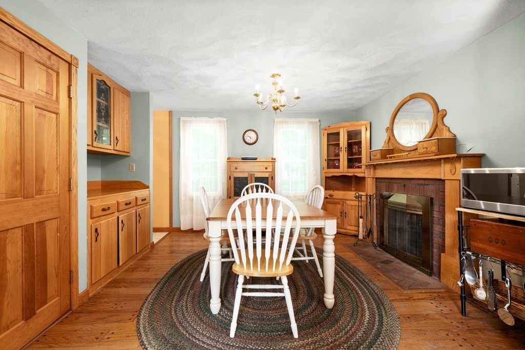 179 Baldwin Road Billerica, MA 01821 - Photo 10 of 38 a view of a dining room with furniture window and wooden floor