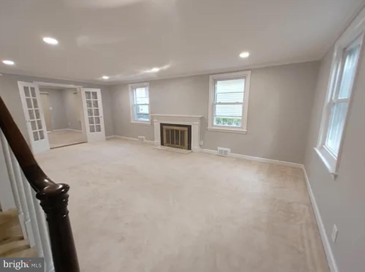 41 Harris Road Princeton, NJ 08540 - Photo 3 of 8 a view of a livingroom with a fireplace and window