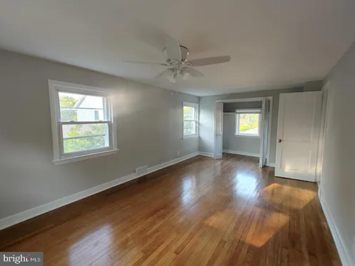 41 Harris Road Princeton, NJ 08540 - Photo 7 of 8 a view of an empty room with wooden floor and a window