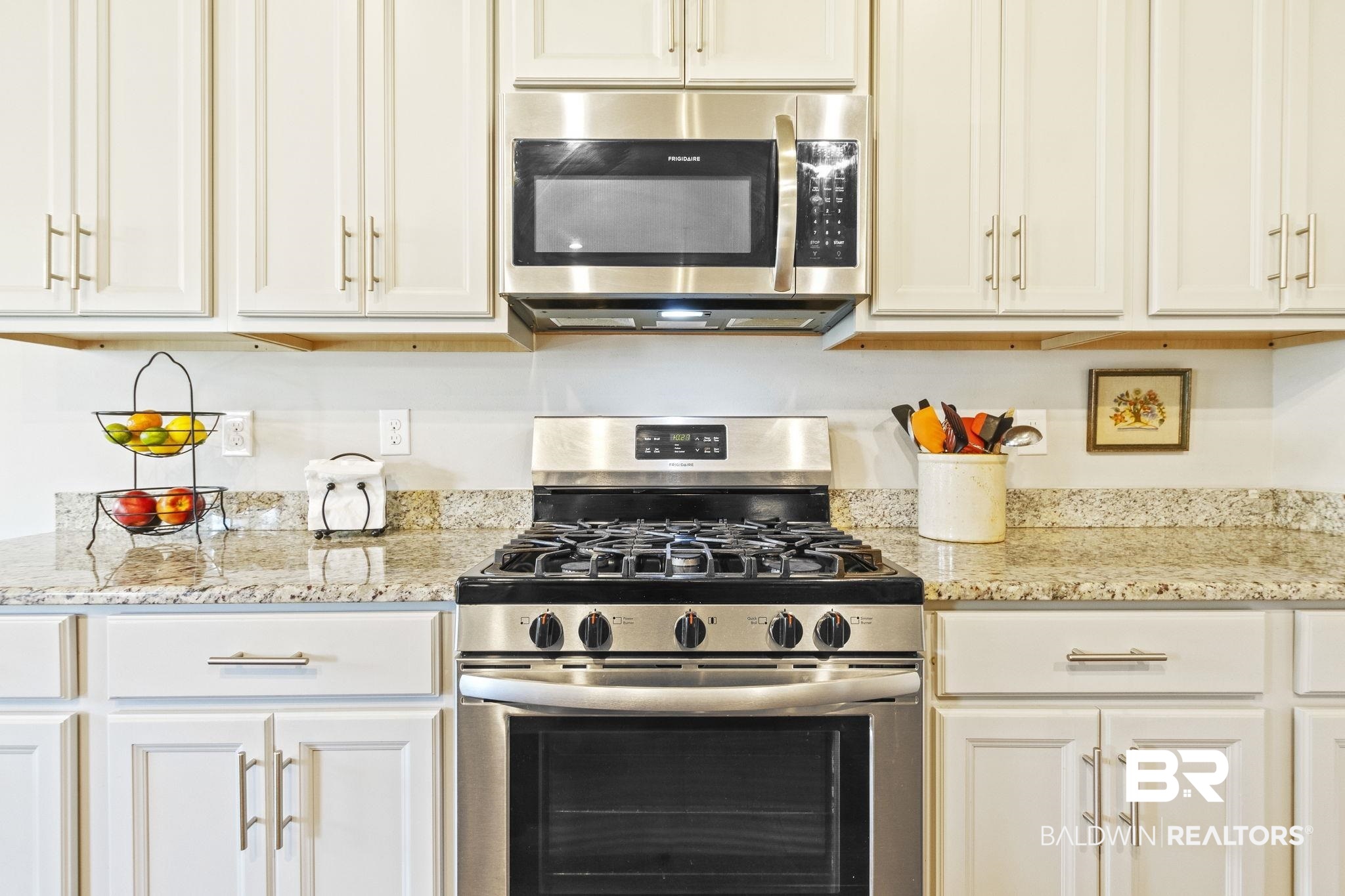 31663 Kestrel Loop Daphne, AL 36527 - Photo 25 of 86 Kitchen featuring stainless steel appliances, light stone countertops, and white cabinets