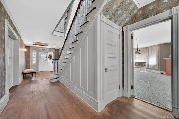 a view of entryway with wooden floor
