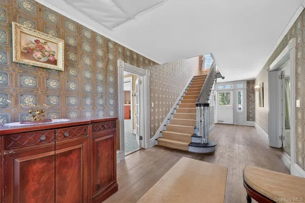 a view of a hallway with staircase