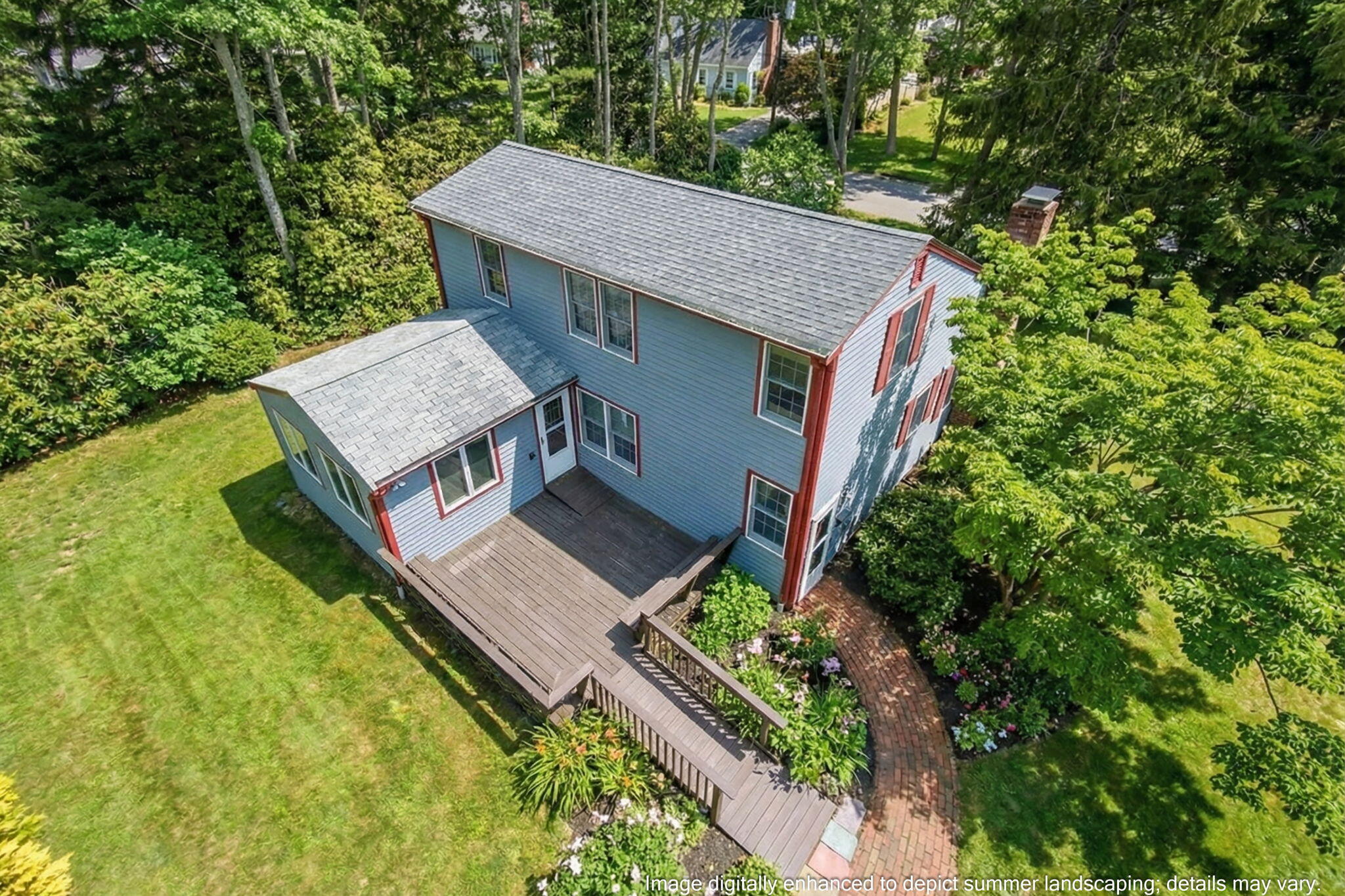 56 Raymond Street Falmouth, MA 02540 - Photo 1 of 45 an aerial view of a house with a yard table and chairs