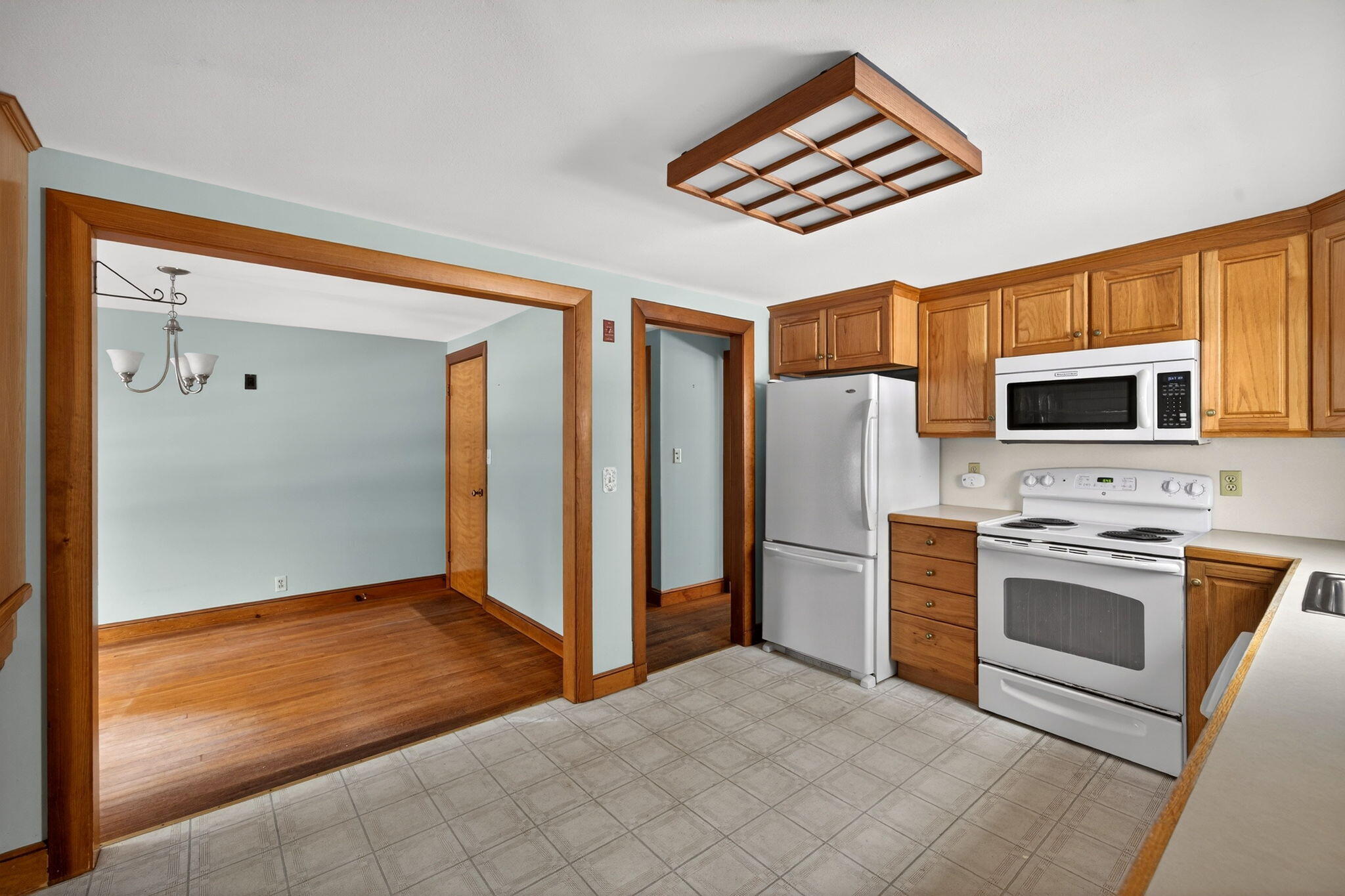56 Raymond Street Falmouth, MA 02540 - Photo 14 of 45 a kitchen with stainless steel appliances granite countertop a refrigerator and a stove top oven