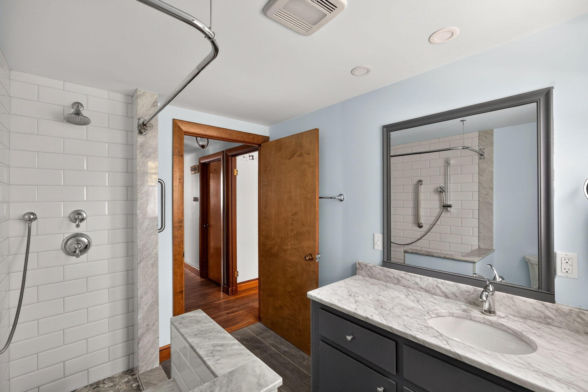 56 Raymond Street Falmouth, MA 02540 - Photo 24 of 45 a bathroom with a granite countertop sink a mirror and shower