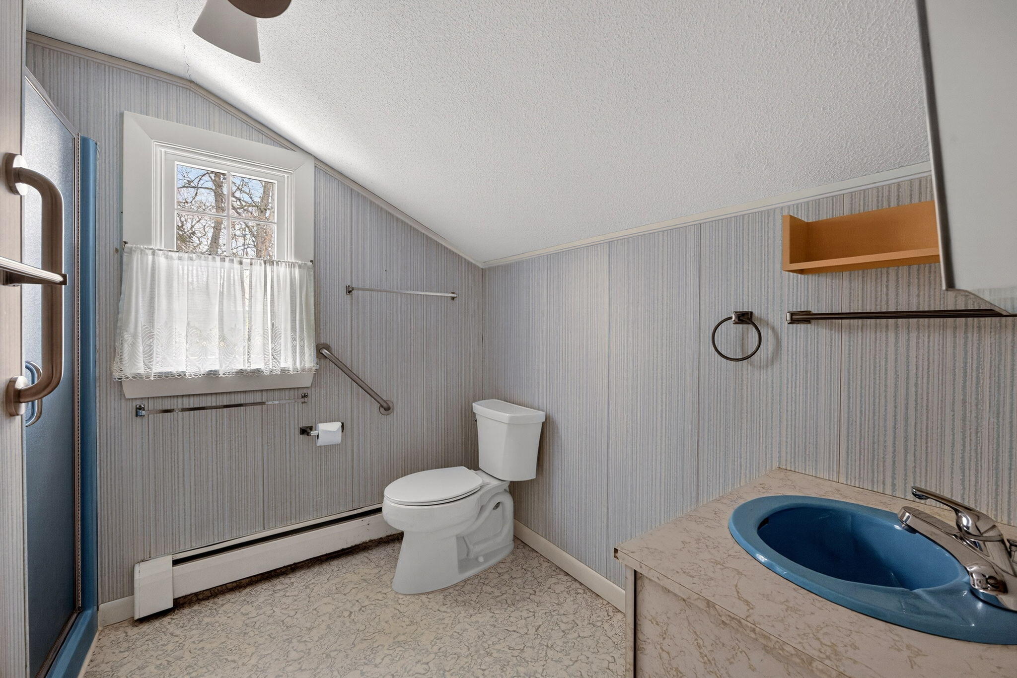 56 Raymond Street Falmouth, MA 02540 - Photo 32 of 45 a bathroom with a granite countertop sink and a mirror