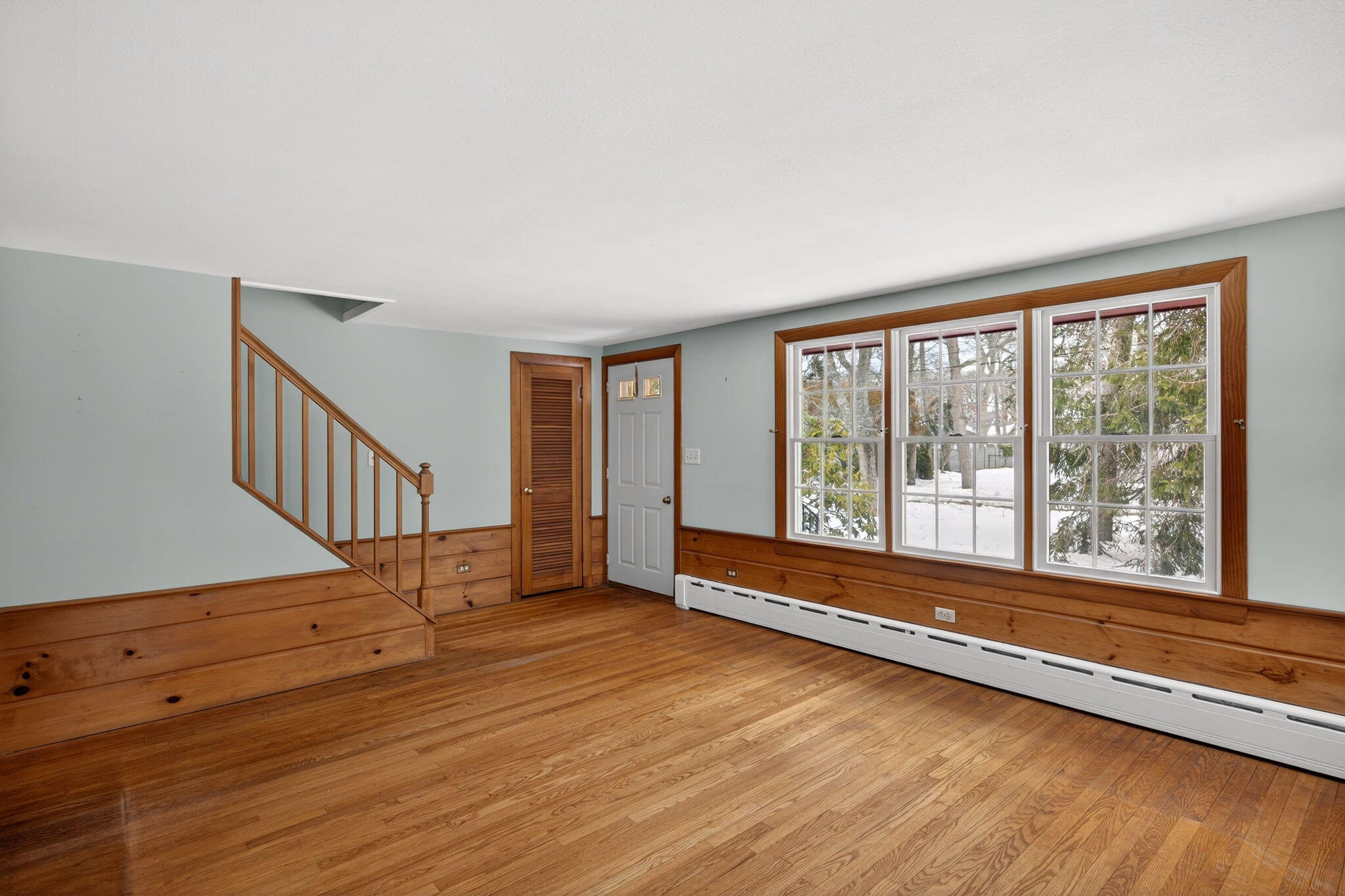 56 Raymond Street Falmouth, MA 02540 - Photo 7 of 45 a view of an empty room with wooden floor and a window