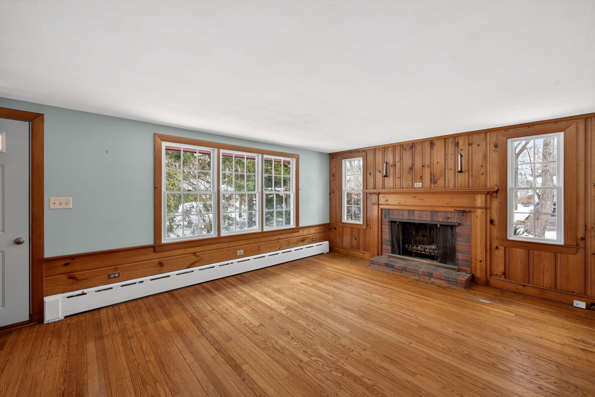 56 Raymond Street Falmouth, MA 02540 - Photo 8 of 45 a view of an empty room with wooden floor and a window