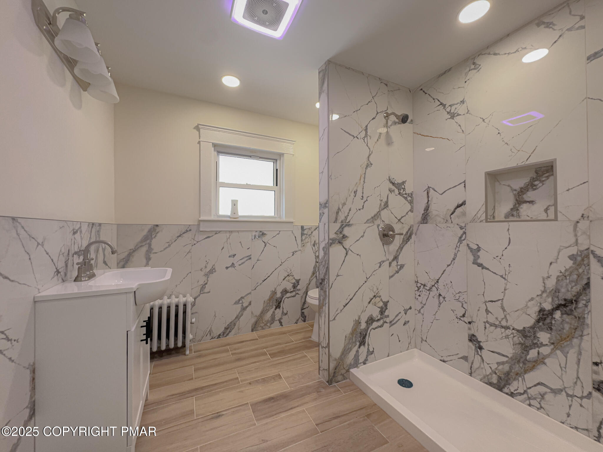 1240 Main Street Pittston, PA 18640 - Photo 20 of 24 a bathroom with a sink a toilet and shower