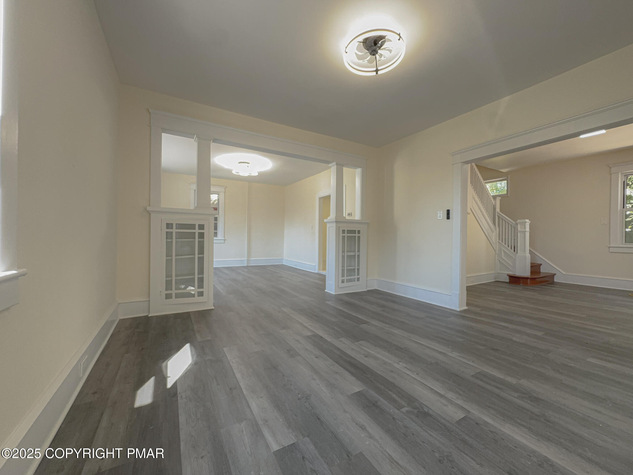 1240 Main Street Pittston, PA 18640 - Photo 6 of 24 wooden floor in an empty room with a window