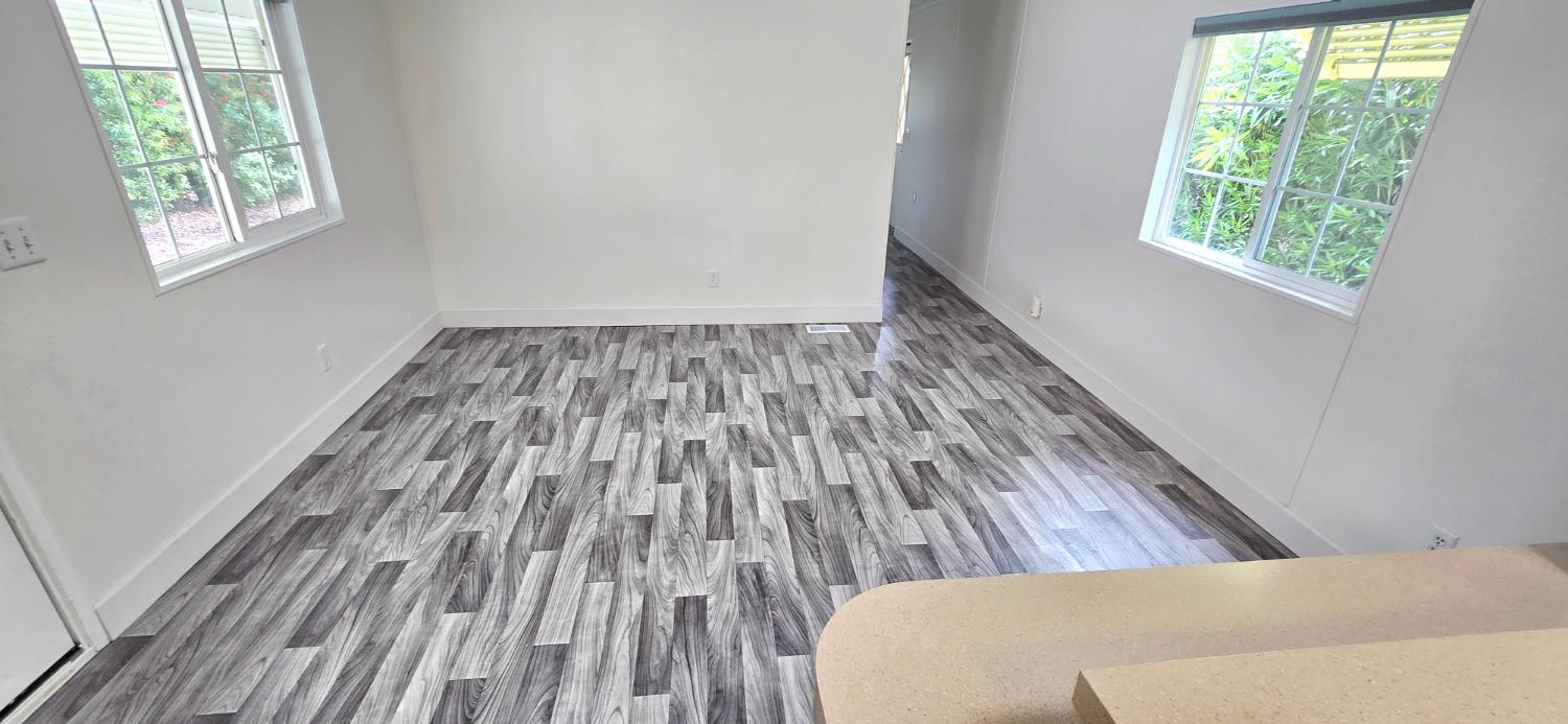 226 Full Circle Davis, CA 95618 - Photo 11 of 27 a view of a room with wooden floor and window