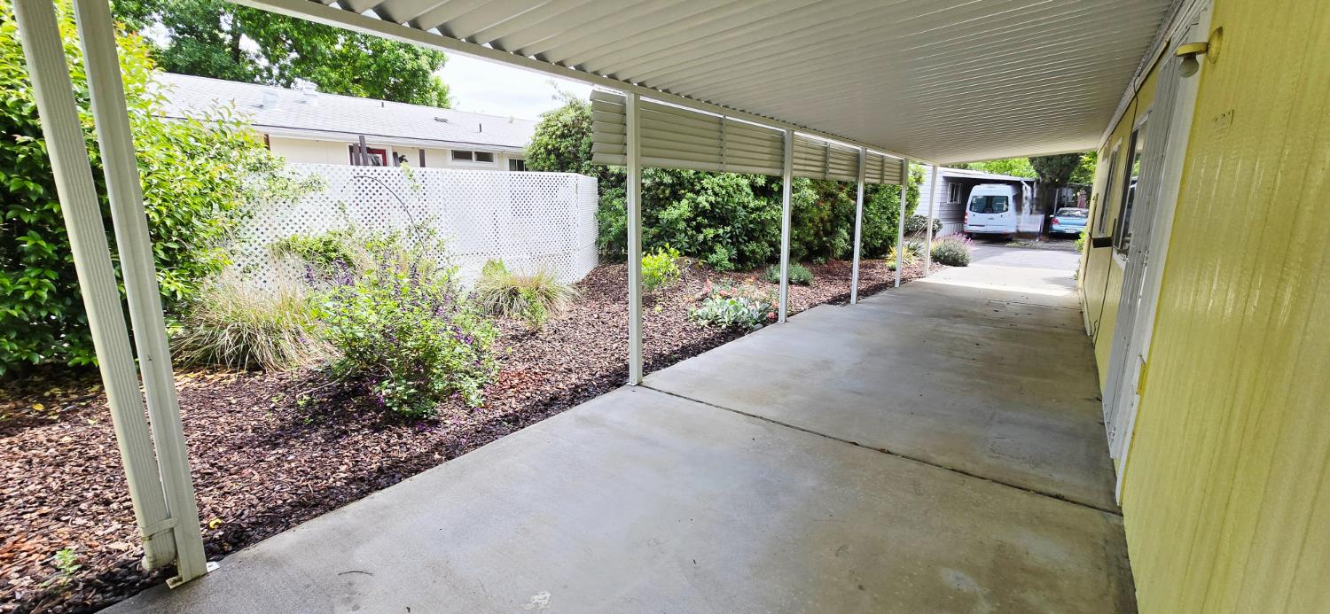 226 Full Circle Davis, CA 95618 - Photo 23 of 27 a view of a porch with plants and garden