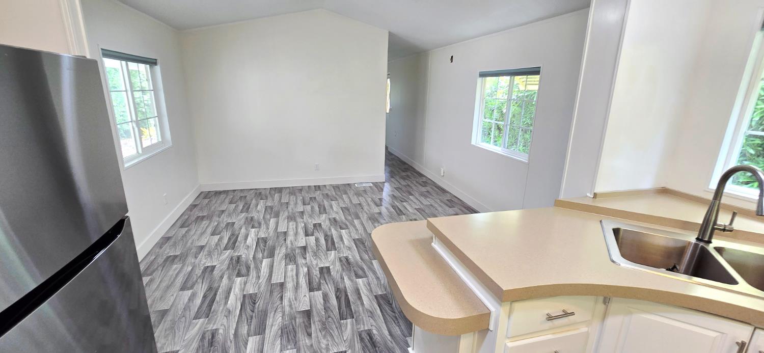 226 Full Circle Davis, CA 95618 - Photo 10 of 27 a view of a kitchen with wooden floor and a sink