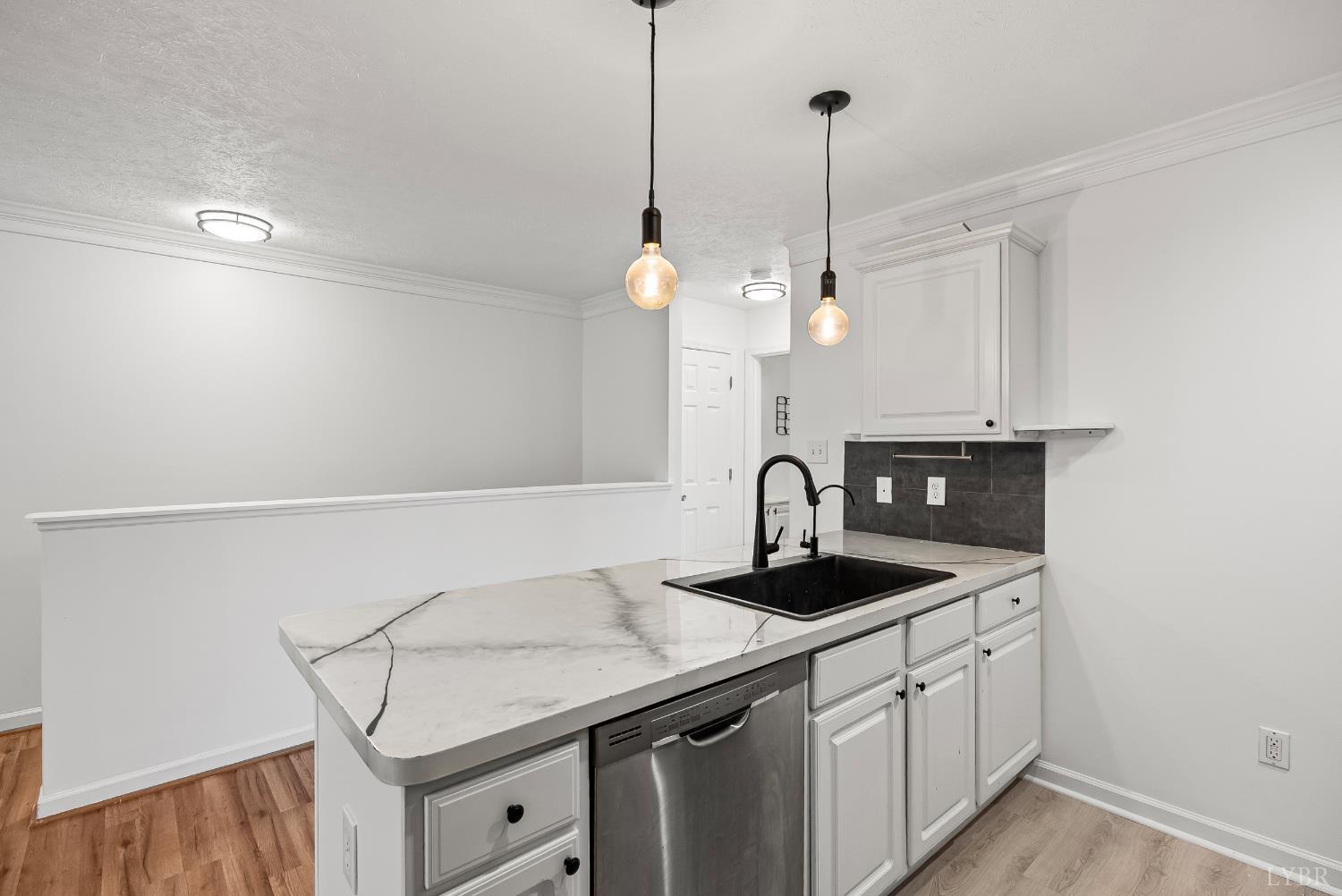 300 McConville Road, Unit 63 Lynchburg, VA 24502 - Photo 11 of 37 a kitchen with a sink cabinets and wooden floor
