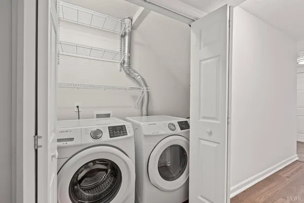 a view of storage and utility room with washer and dryer