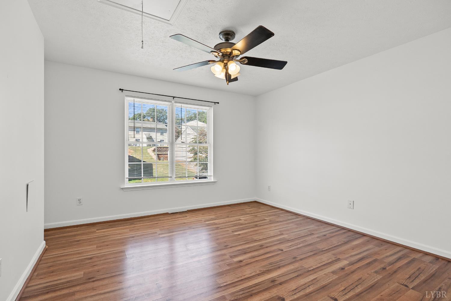 300 McConville Road, Unit 63 Lynchburg, VA 24502 - Photo 14 of 37 wooden floor in an empty room with a window